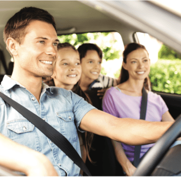 Family driving in car with in-car navigation