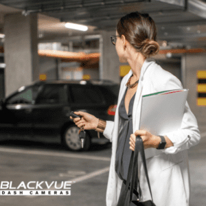 Woman locking car and leaving it in car park protected with BlackVue Dash Camera
