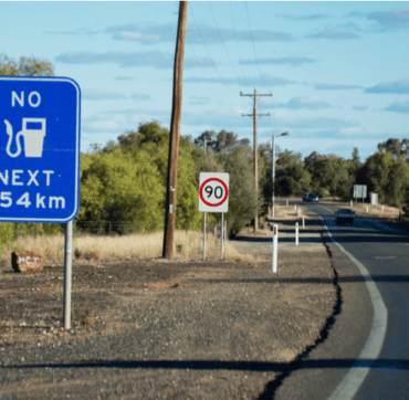 Highway with a fuel and speed sign