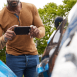 Man taking picture of a car accident